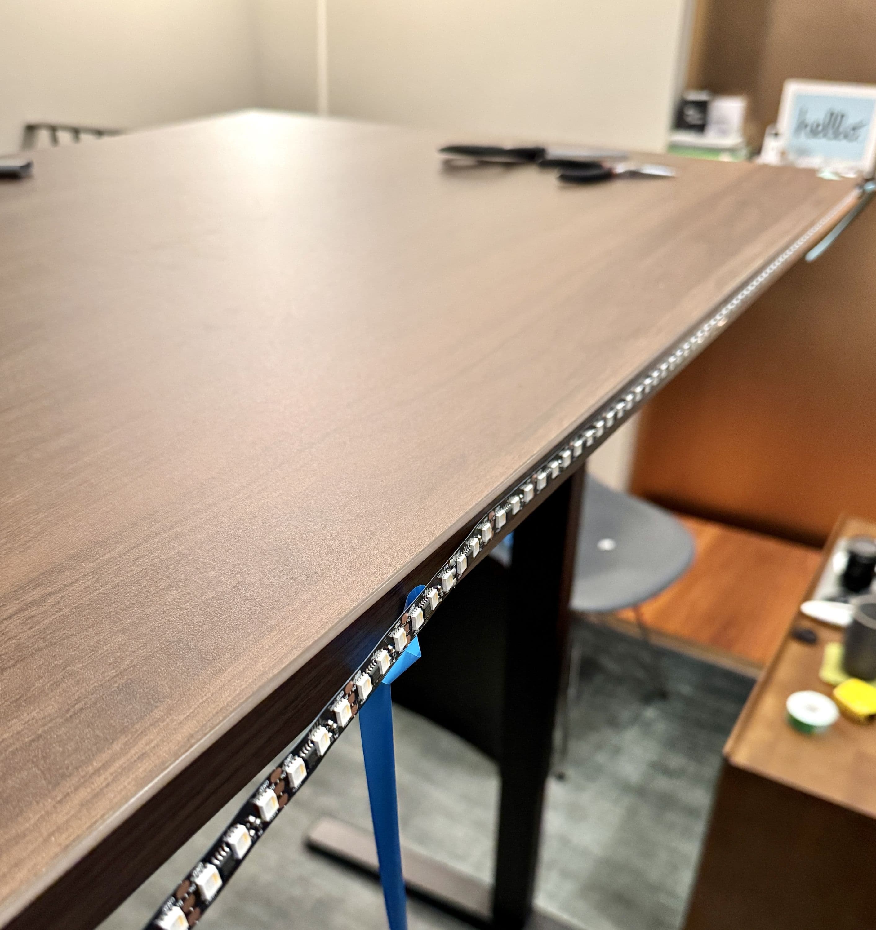 Mounting the LED strip to the back of the desk