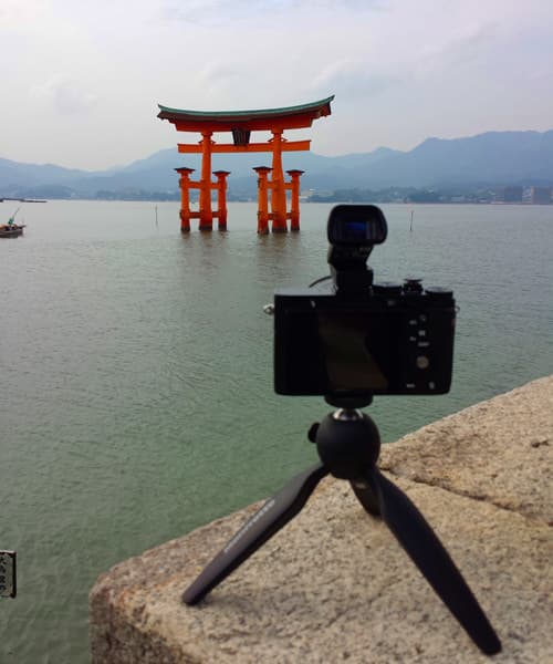 Another photo of person with camera on tripod