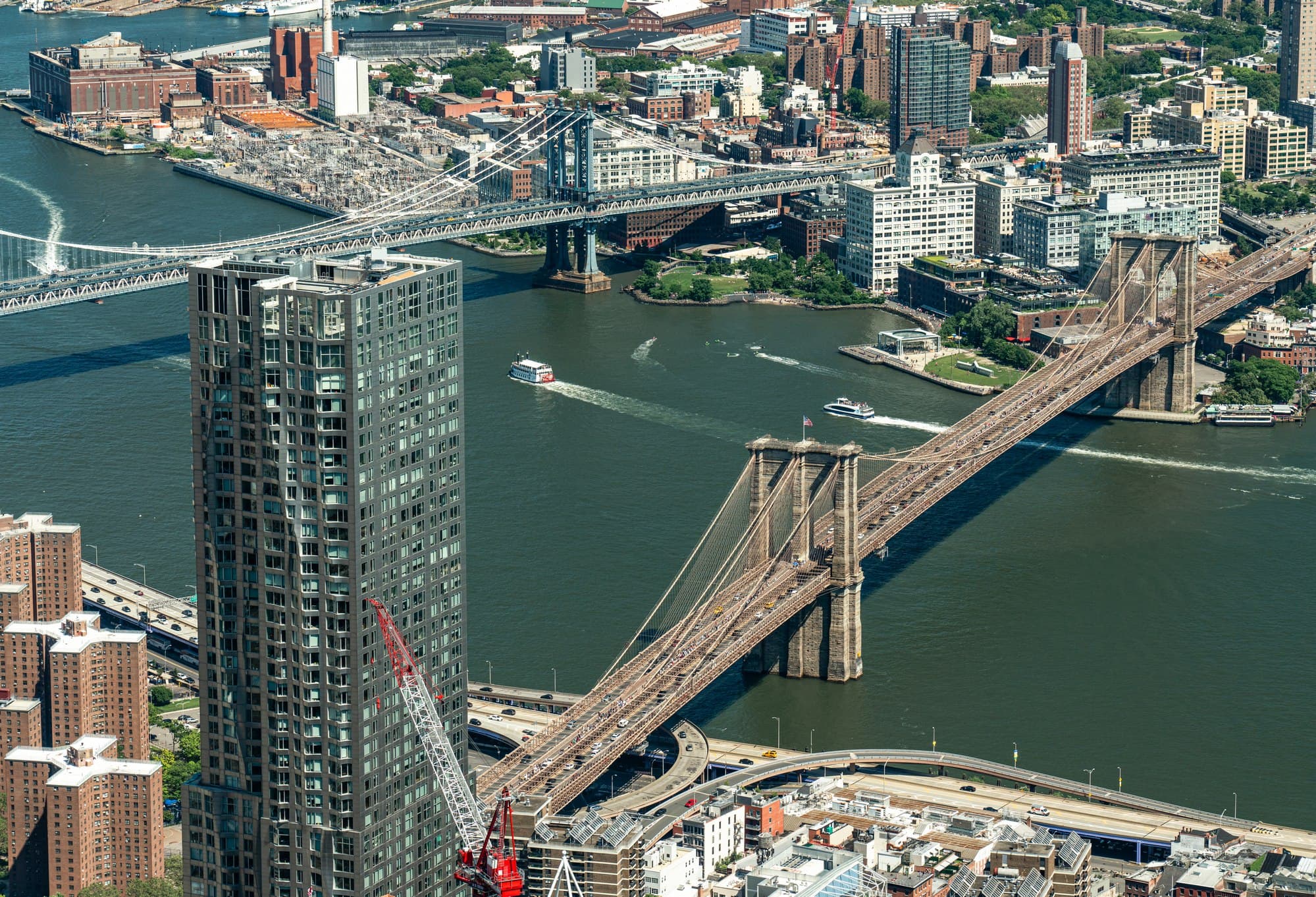 Manhattan Bridge and Brooklyn Bridge spanning the East River to Brooklyn.